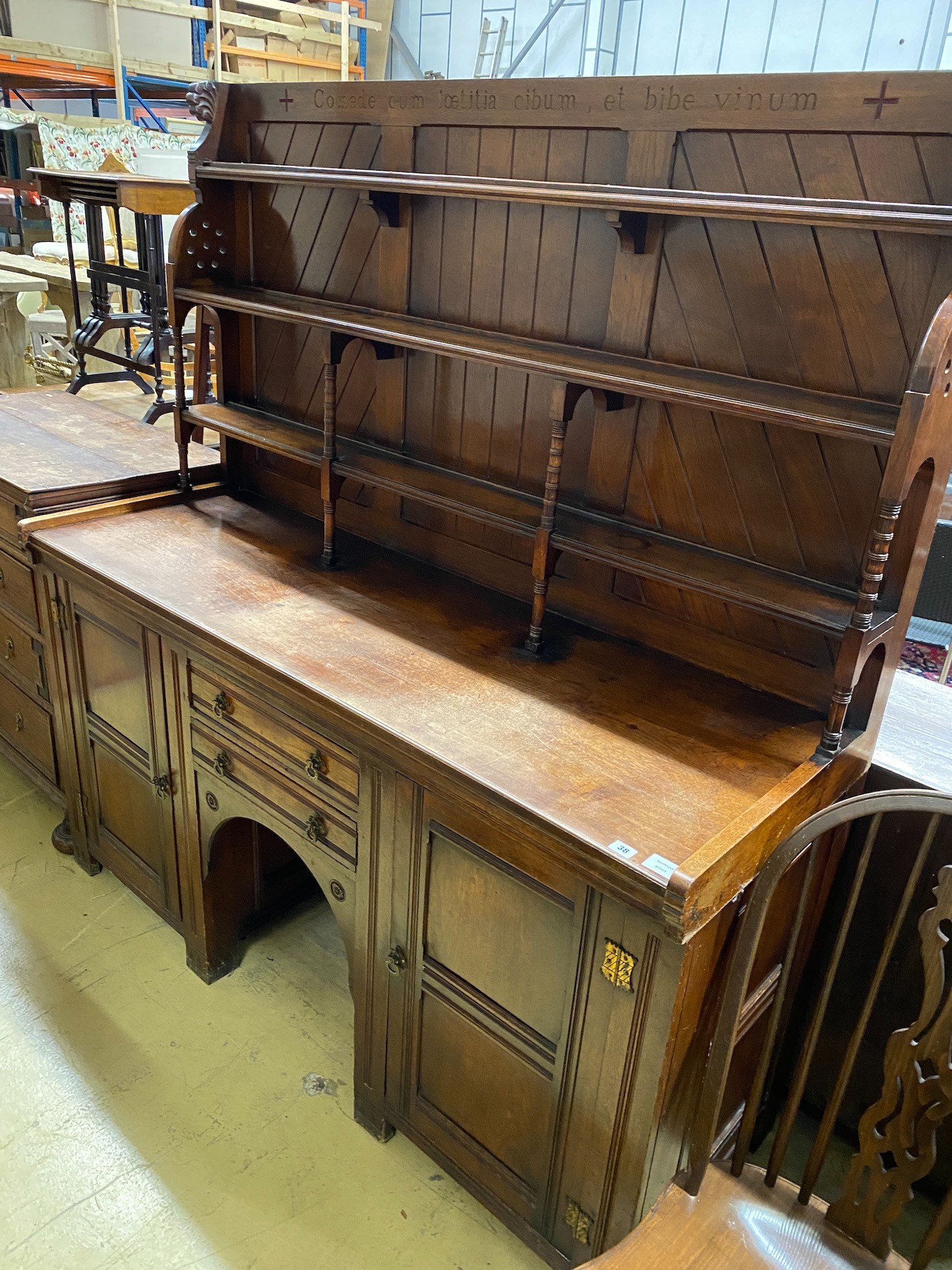 A Victorian aesthetic movement mahogany sideboard, with Latin motto to the frieze, width 168cm, depth 60cm, height 182cm